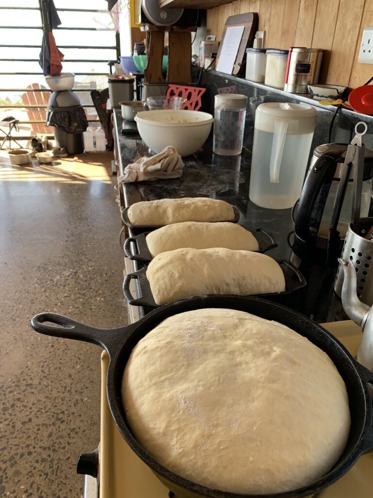 I enjoy making sour dough bread in cast iron pans.  So yummy!